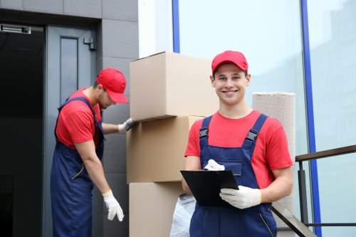 Packed moving boxes and household items inside a hired removal truck