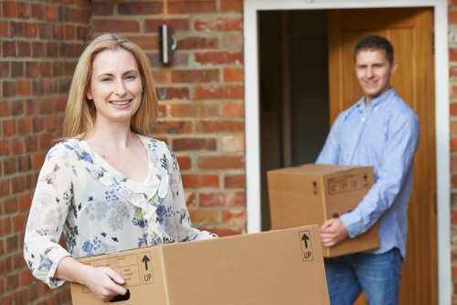 Packed office boxes and workstation items ready for transport in Chiswick