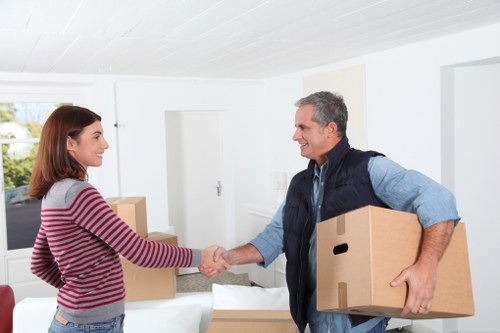Careful loading of boxes and furniture for a student move in West London