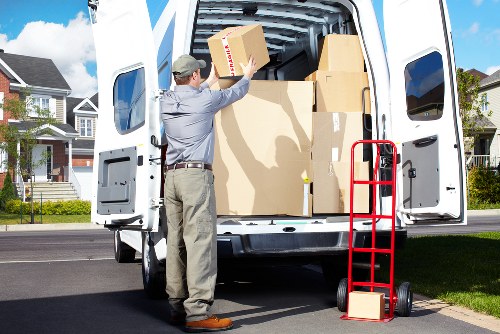 Relocation staff handling office items during a Chiswick move