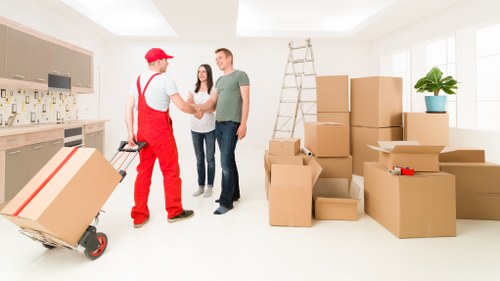 Movers preparing equipment safely before lifting items