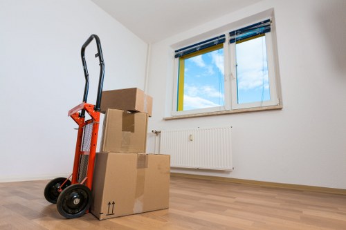 Removal team managing flat access in Chiswick