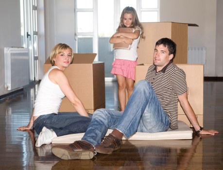 Movers assessing a property and access points before relocation